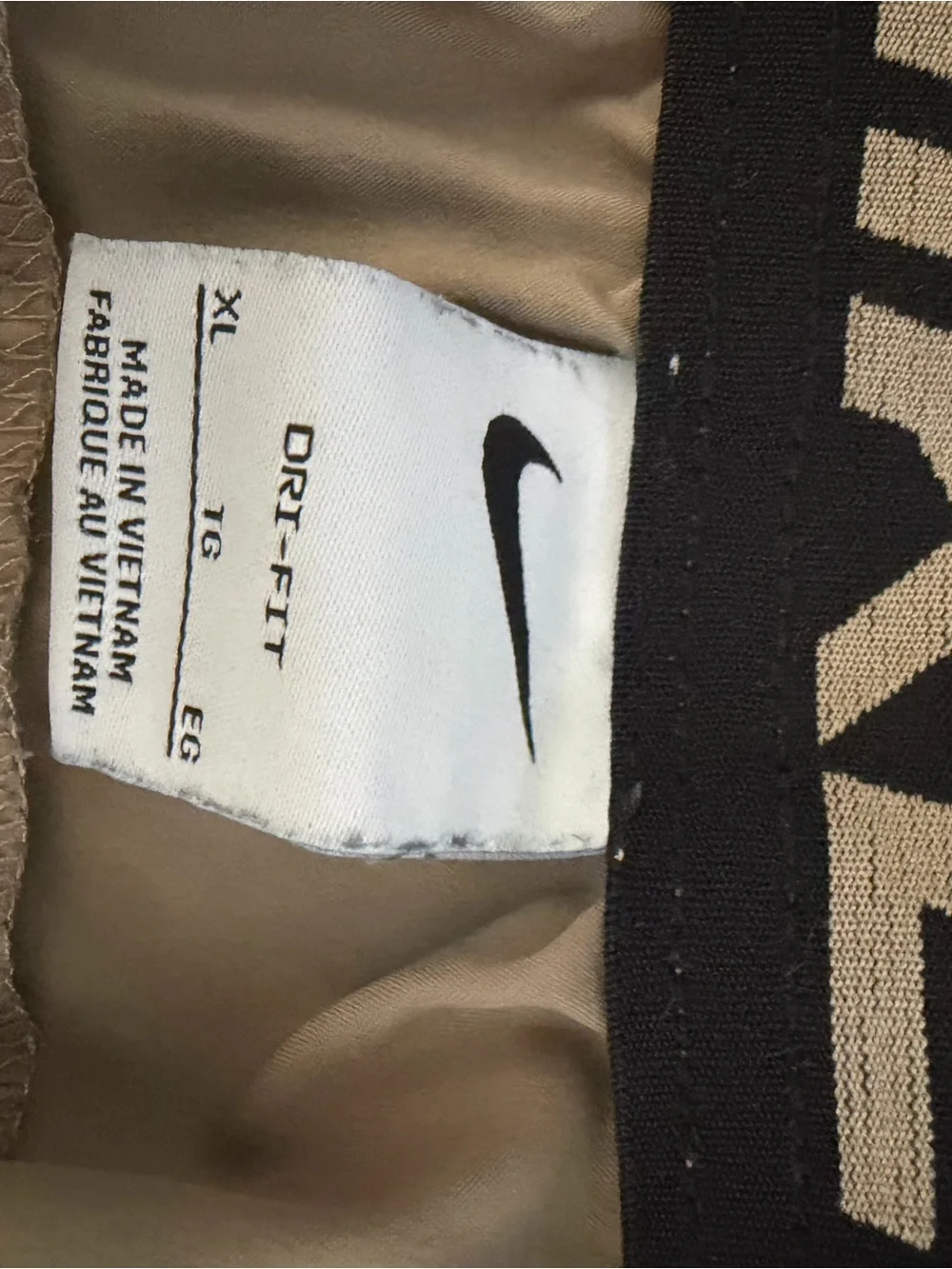 Nike Men's Light Cream Athletic Shorts with Black Drawstring